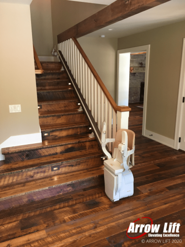 Indoor straight stairl ift on wooden stairs - Arrow Lift 2020