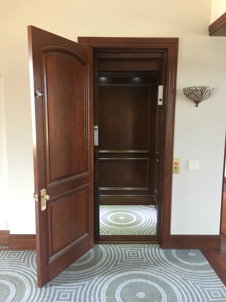 sleek wood home elevator arrow lift