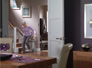 Woman on stairlifft. Handicap lifts for home options
