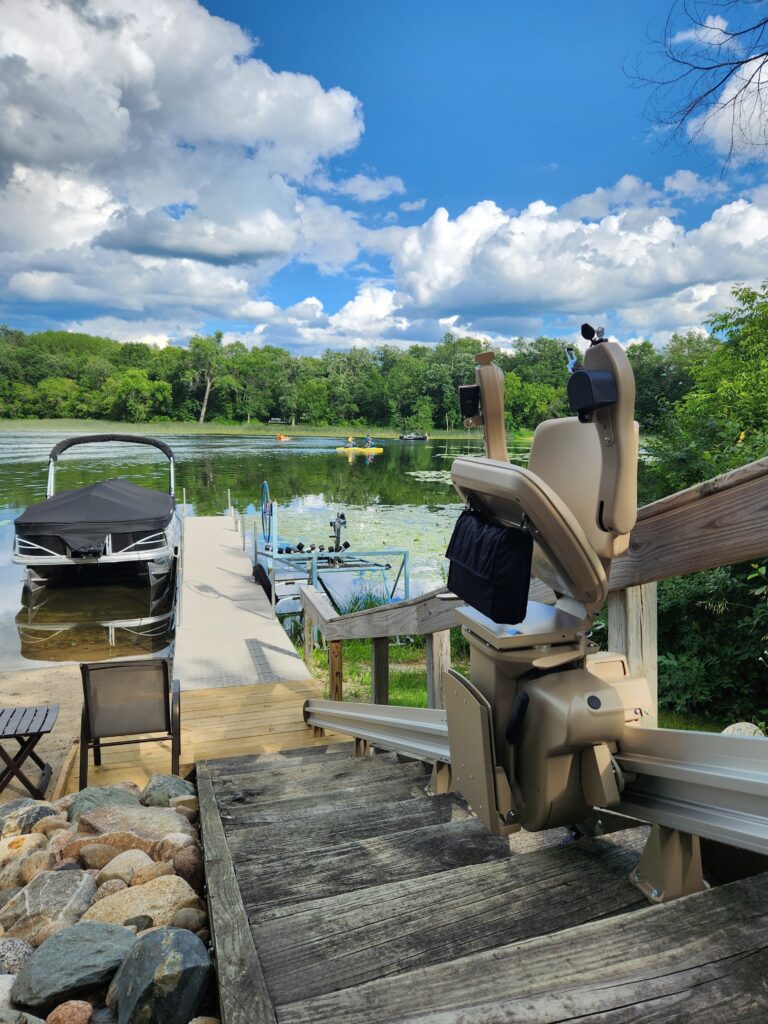 Outdoor stair lift leading to a dock on a lake