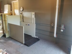 vertical platform wheelchair lift in a residential garage