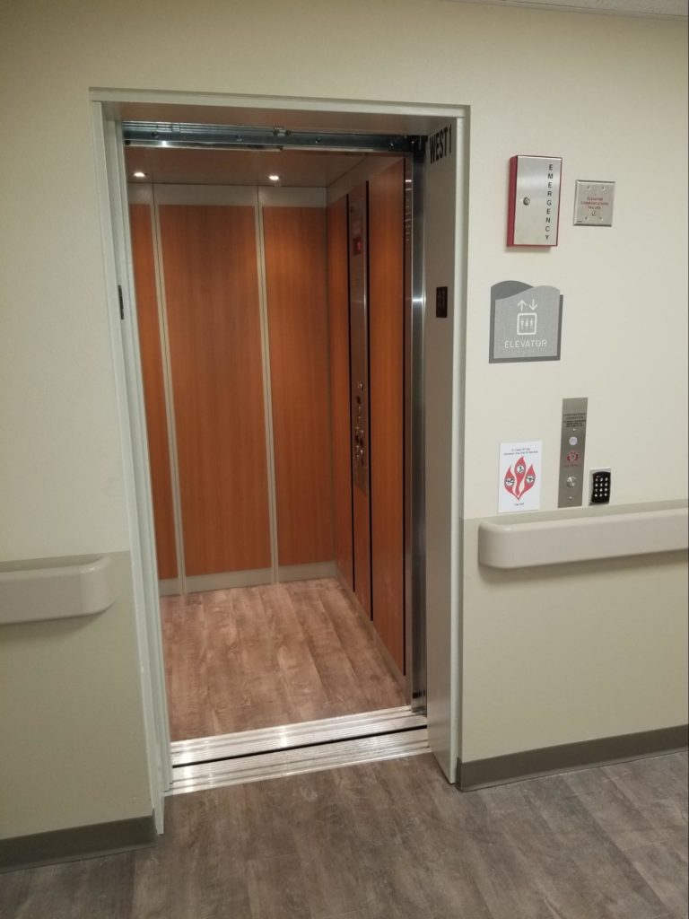 Image of LULA elevator with open doors and wood interior