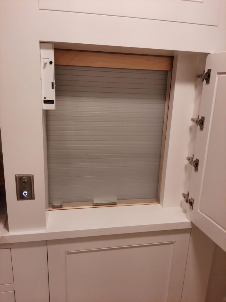 Image of a residential dumbwaiter with the interior door closed.