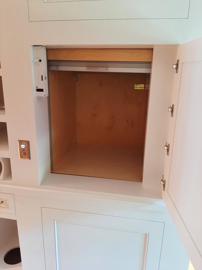 Image of a residential dumbwaiter with the interior door open