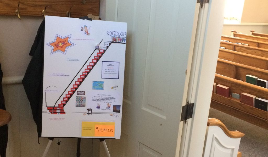 Image of a stair lift fundraiser poster board created for a place of worship. 