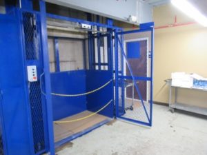 Blue metal casket life with doors open