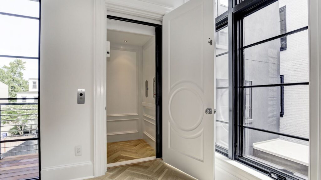 Open door to a custom, luxury home elevator