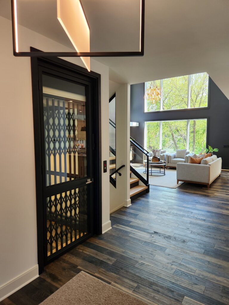 Black metal and glass residential elevator - Arrow Lift