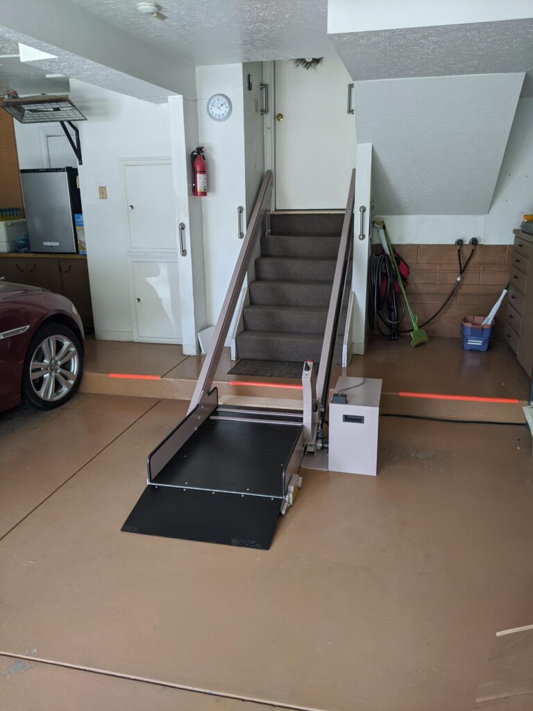 Inclined Platform List at base of Garage stairway leading into home