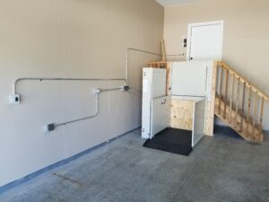 Wheelchair Platform List at base of Garage stairway leading into home