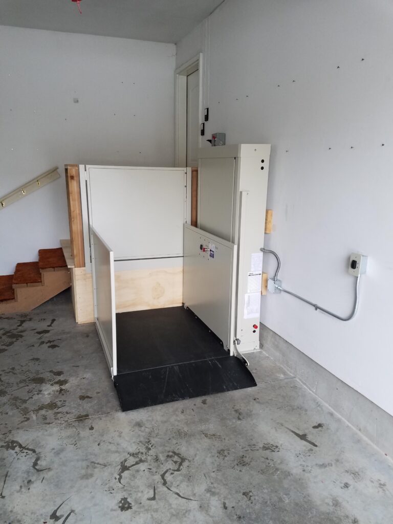 Wheelchair Platform List at base of Garage stairway leading into home