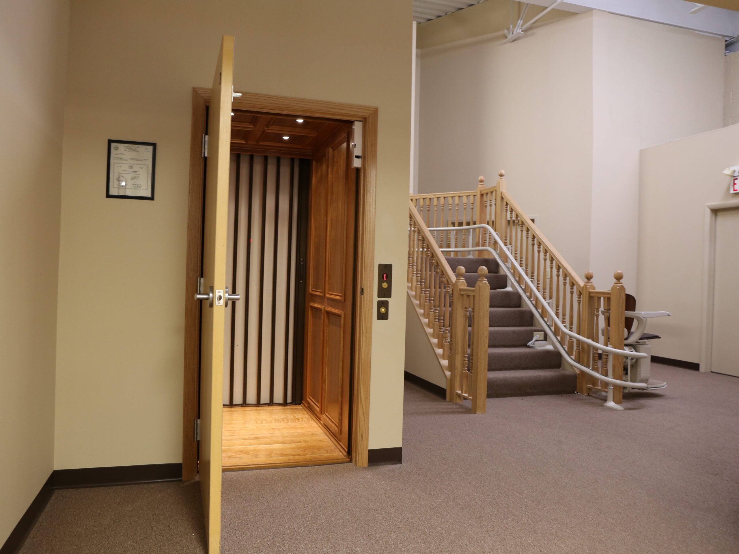 Arrow Lift Home Elevator showroom with working elevator at base of staircase