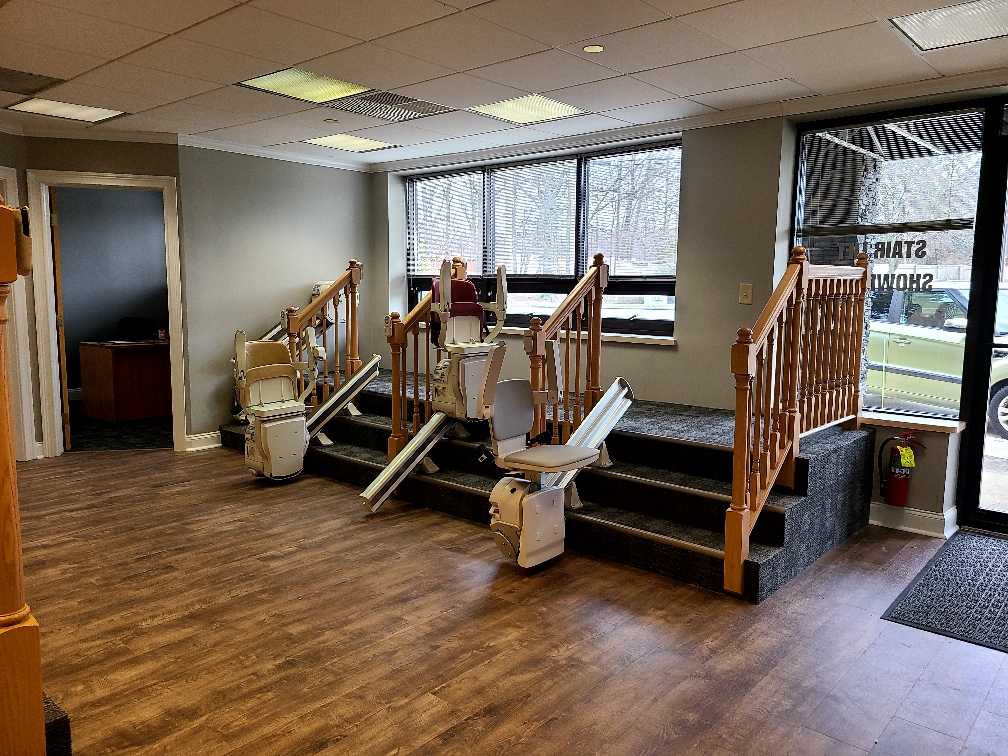 Interior of Arrow Lift Showroom with several stair lift models on display.