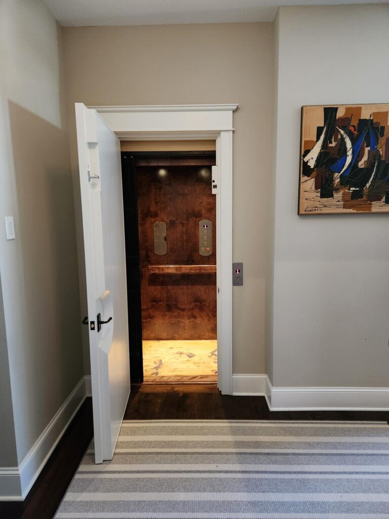 Traditional home elevator with wooden interior