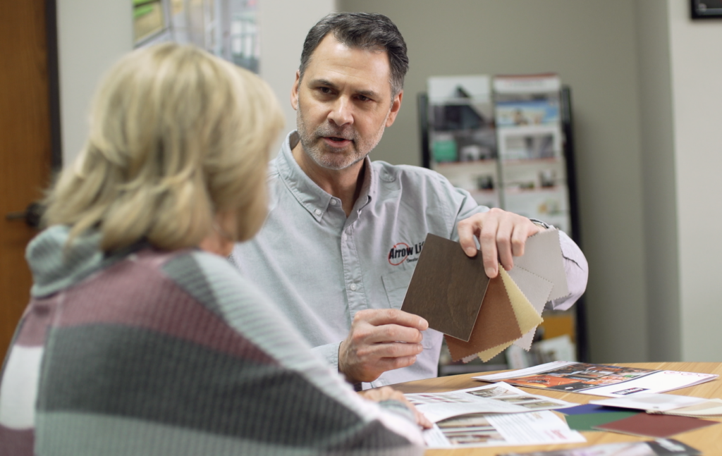 Salesman talking through options with a client