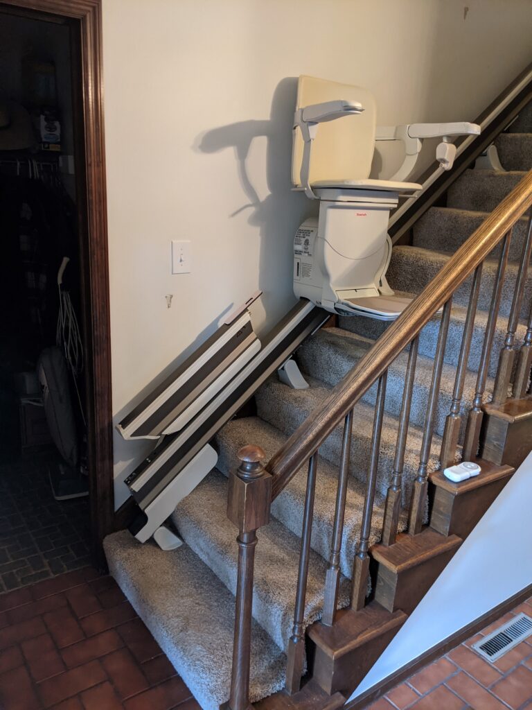 stair lift with a retractable rail in the retracted position