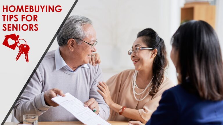 An elderly man and woman look at each other happily as they review a document with an advisor.