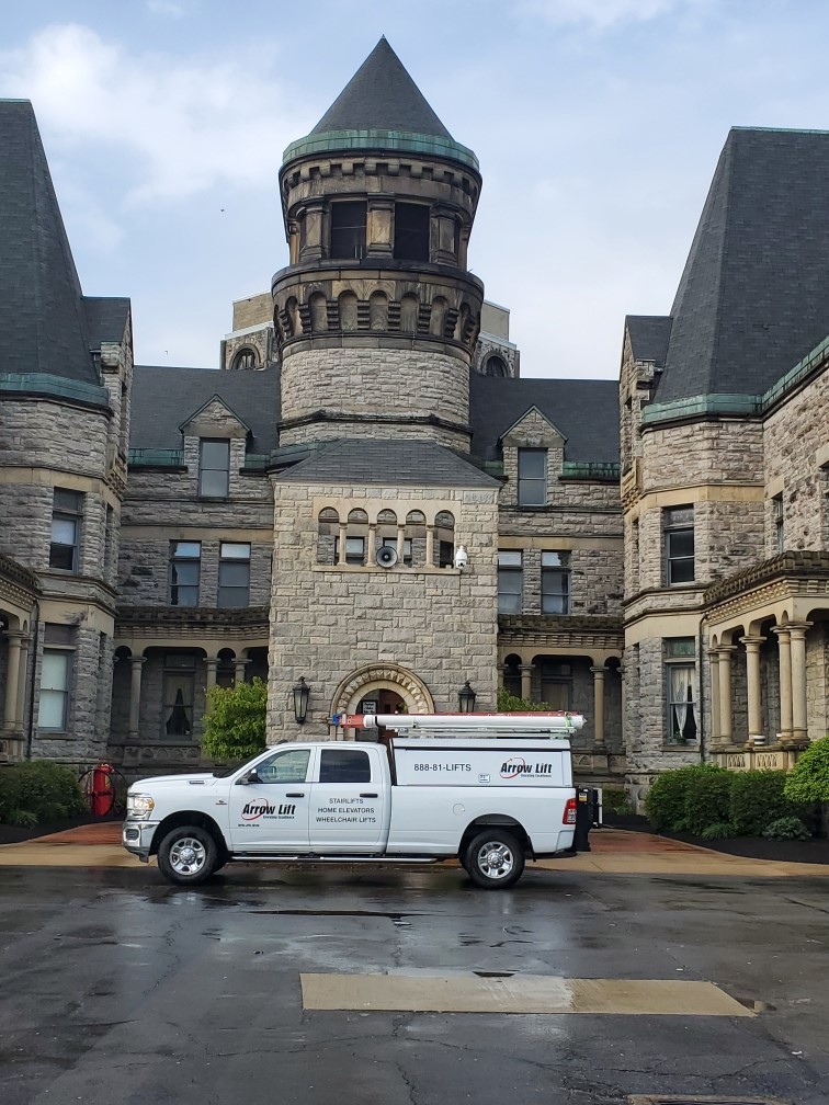 Arrow Lift truck in front of the Mansfield Reformatory