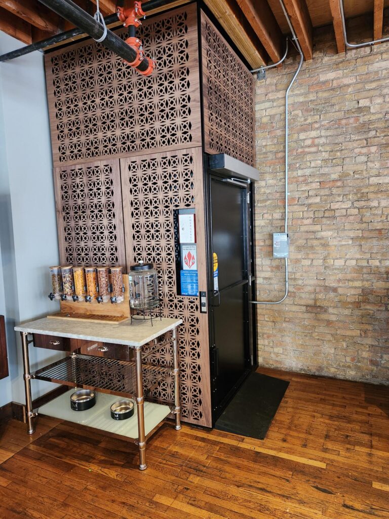 vertical platform lift with custom applique on the exterior