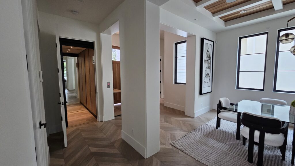 Home elevator in SoCal with a full length mirror on the back wall