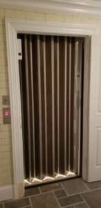 Accordion elevator car door